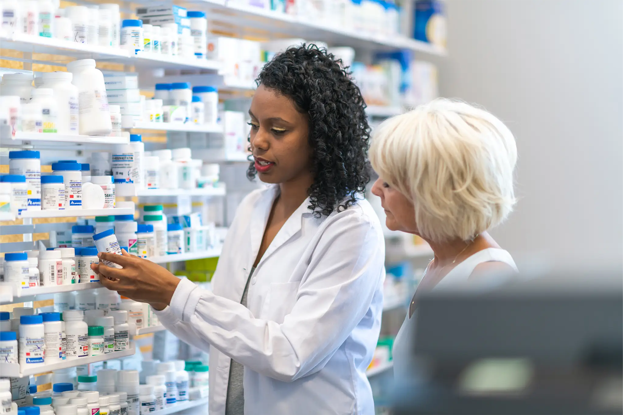 Pharmacist assisting patient