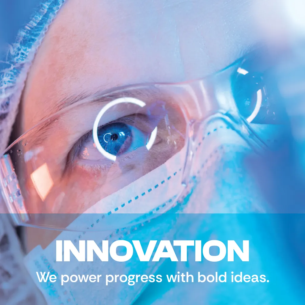 Innovation. We power progress with bold ideas. A close-up photo showing a scientist wearing protective glasses. Innovation. We power progress with bold ideas. A close-up photo showing a scientist wearing protective glasses.
