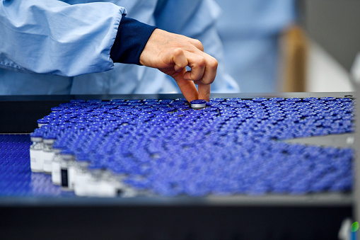 Worker's hands checking samples in factory