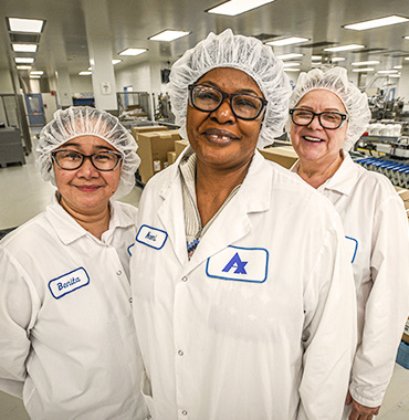 Apotex employees smiling in factory